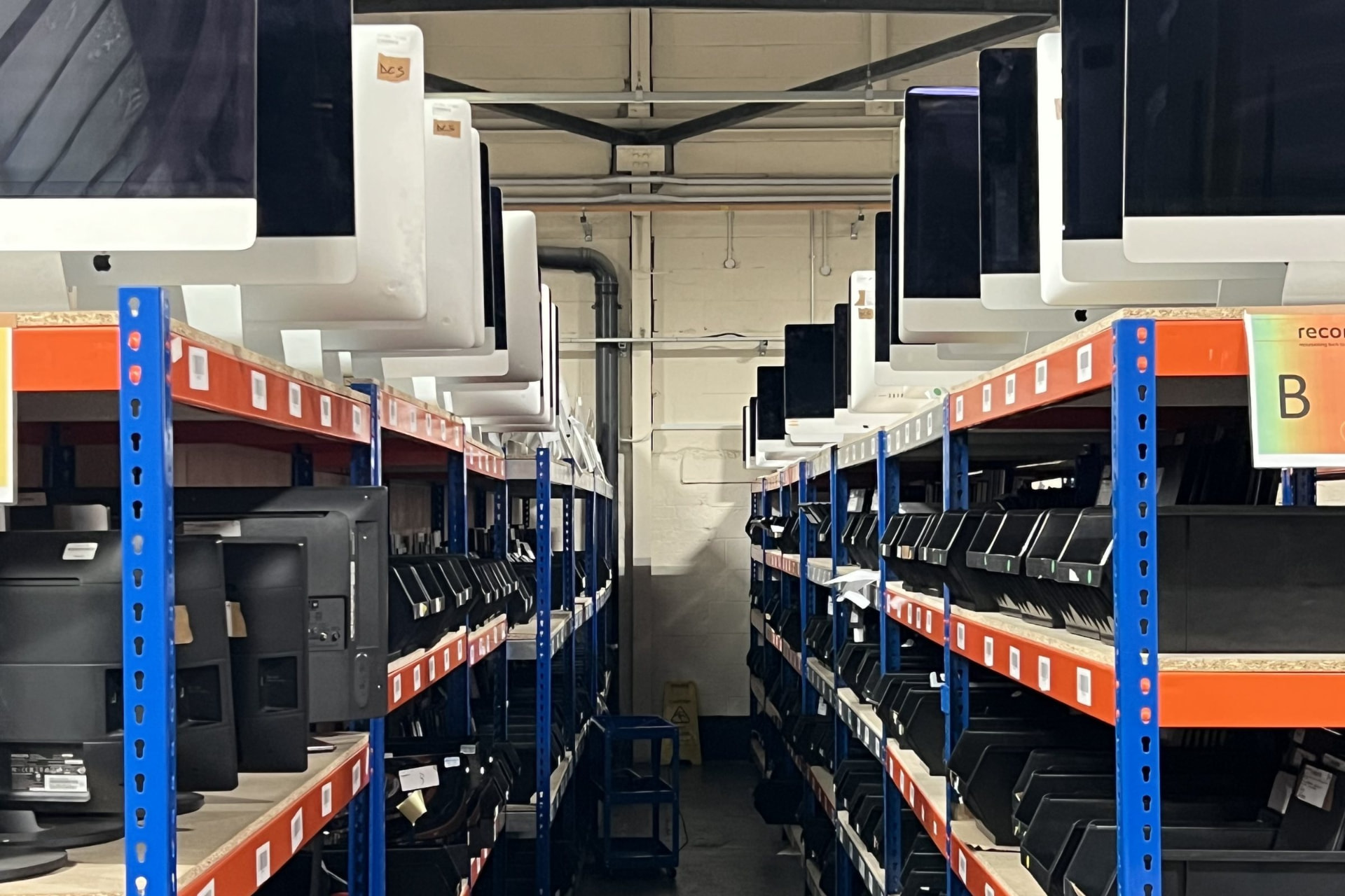 Racked devices awaiting processing at Reconome's Rotherham distribution centre.