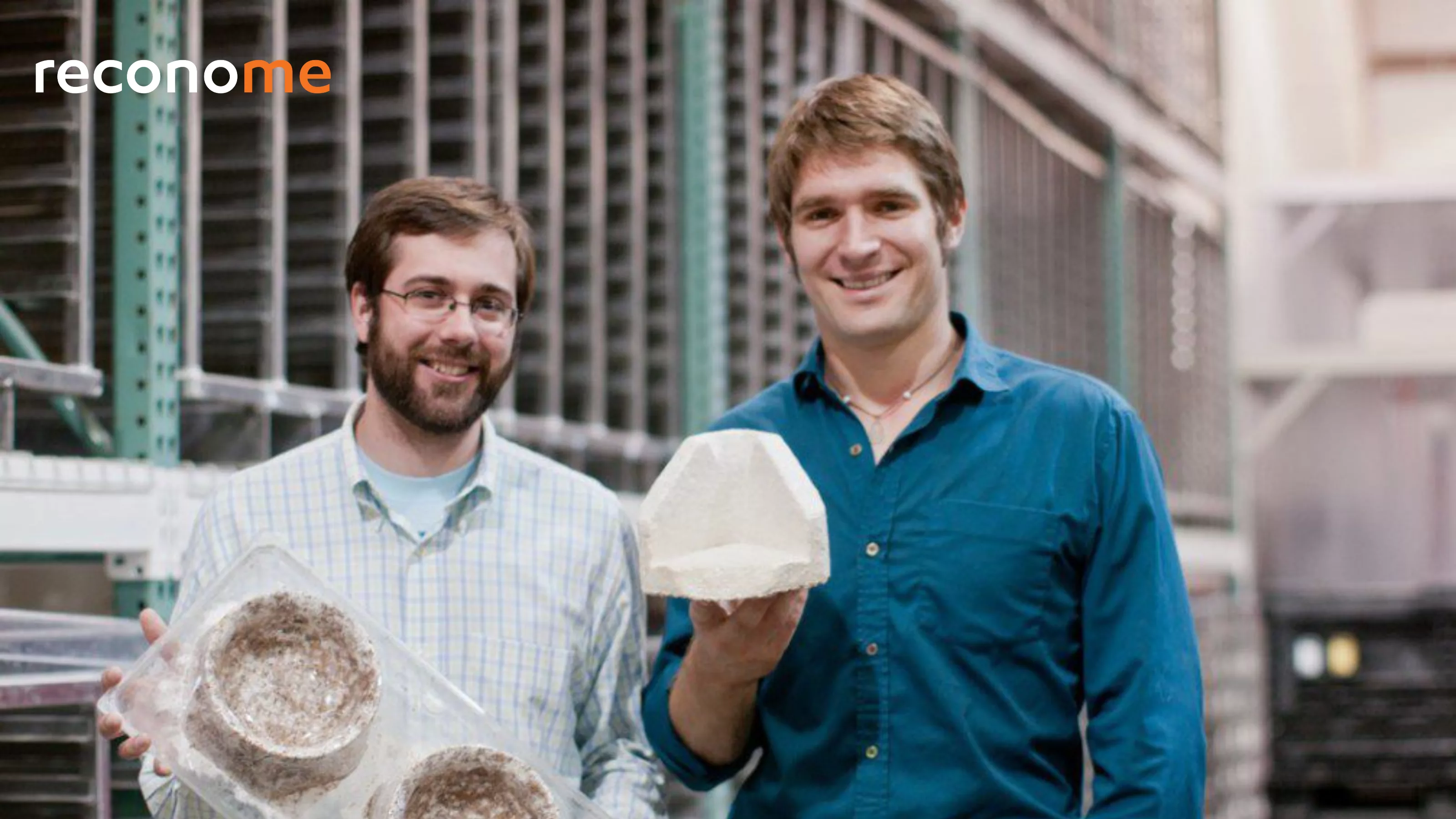 Two people standing outdoors holding product packaging.