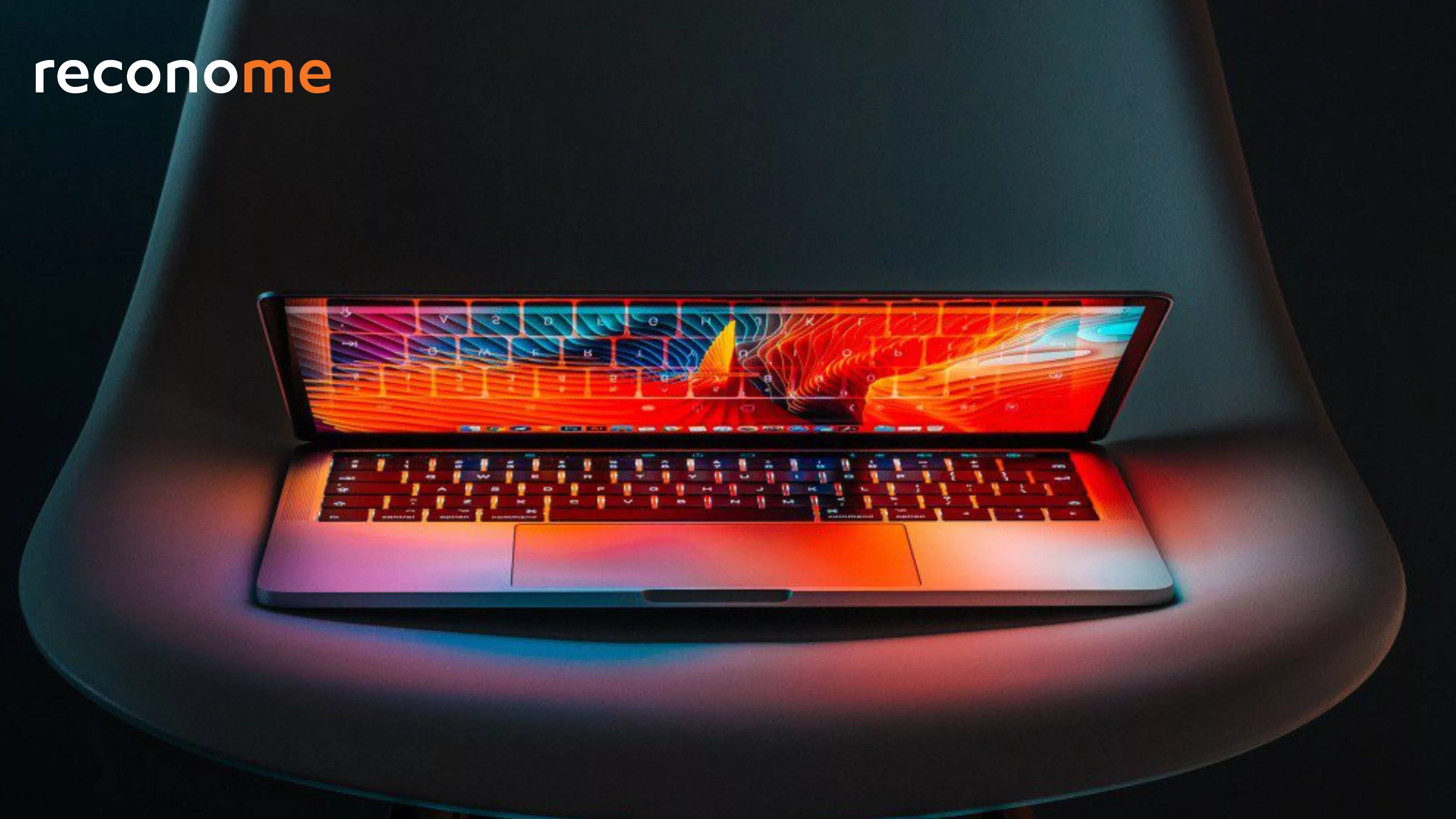 A brightly lit laptop on a dark background.
