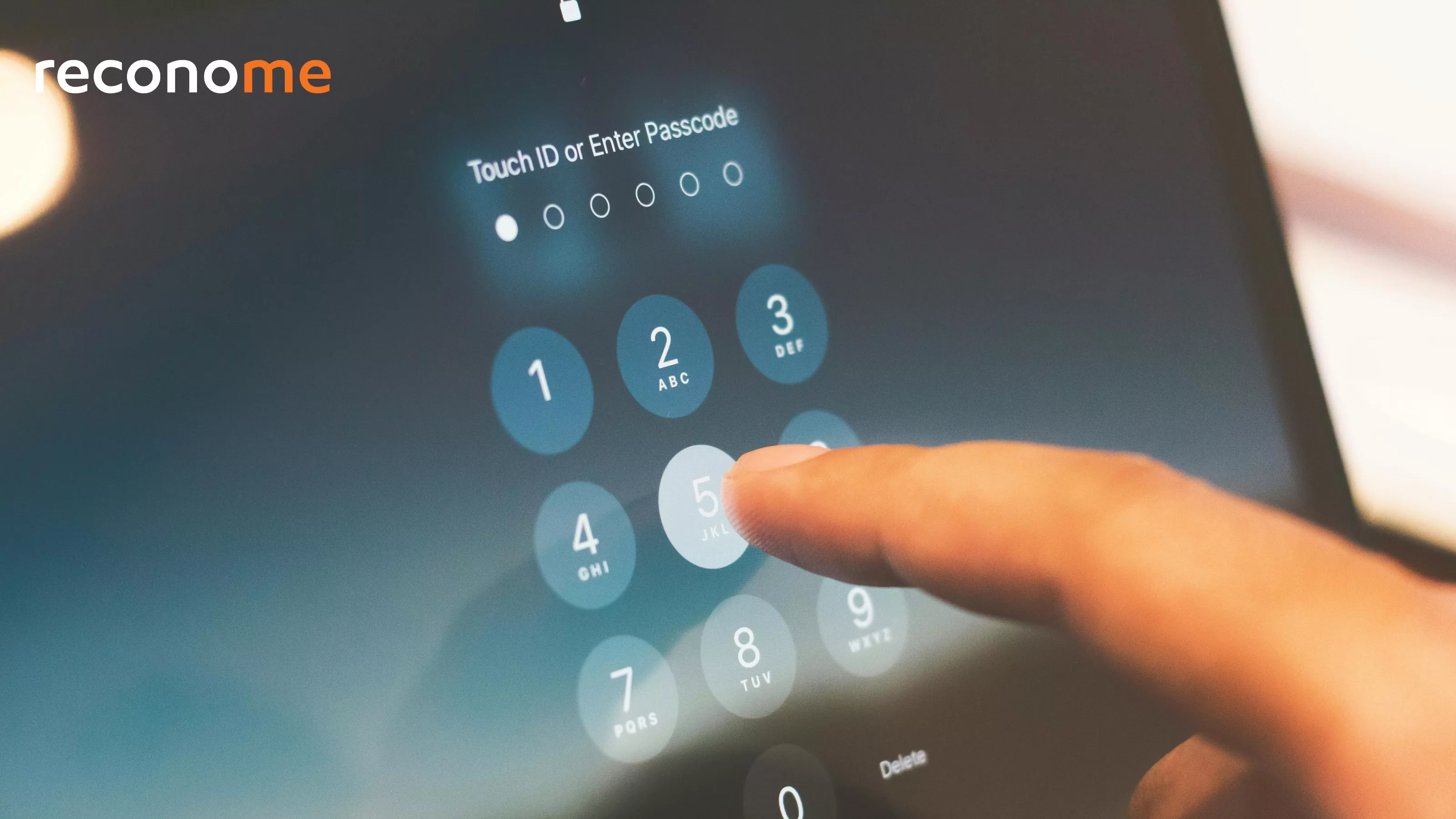 A finger entering a passcode on a phone.