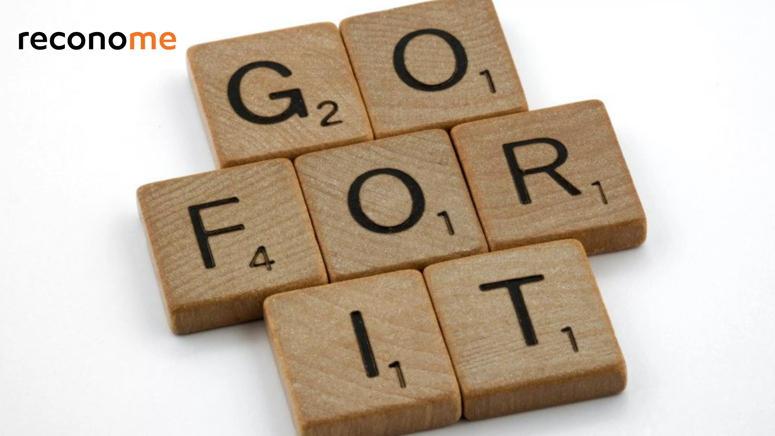 Letter tiles spelling Go For It on a desk.