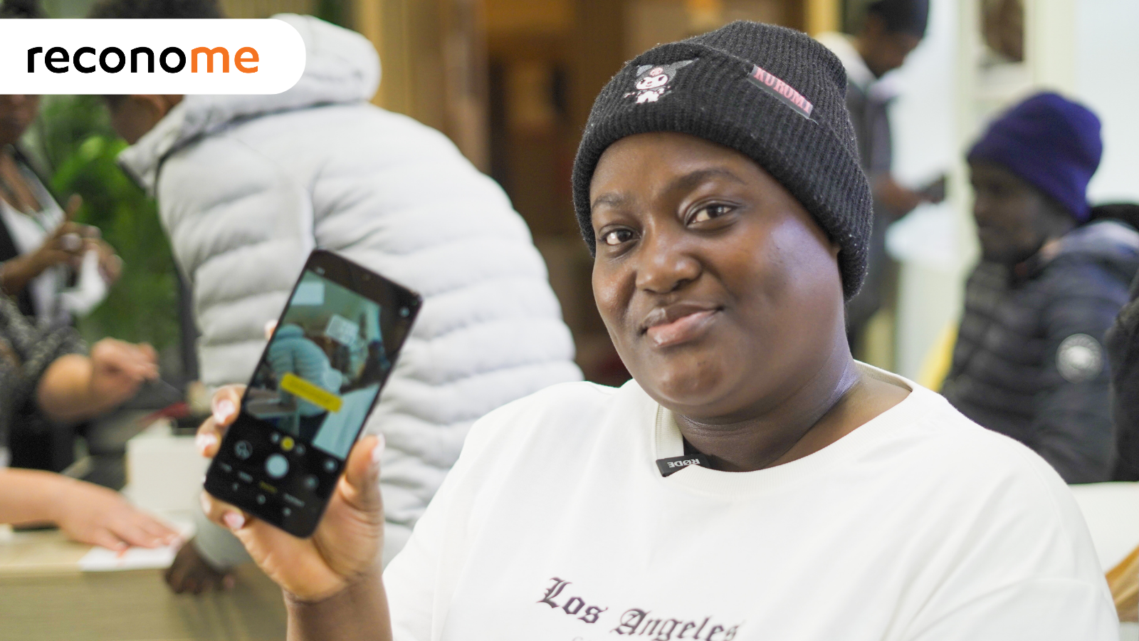 Paule, a National Device Bank beneficiary, with her refurbished phone